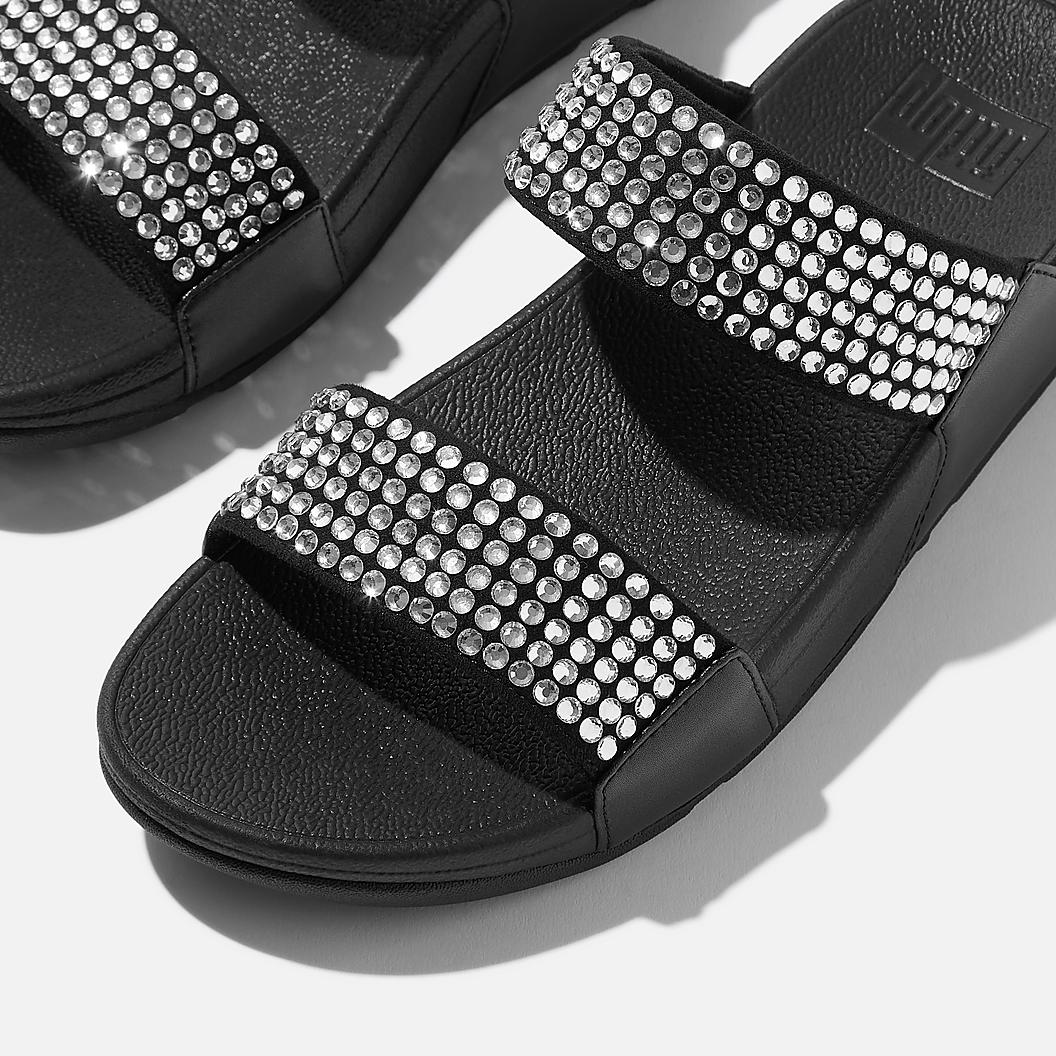 Shop FitFlop Microwobbleboard Embellished Wedge Slides in Black & Silver at Truvai Select. Oversize crystal straps, 4.75cm heel, and APMA-accepted support.