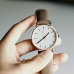 Classic wristwatch held in hand